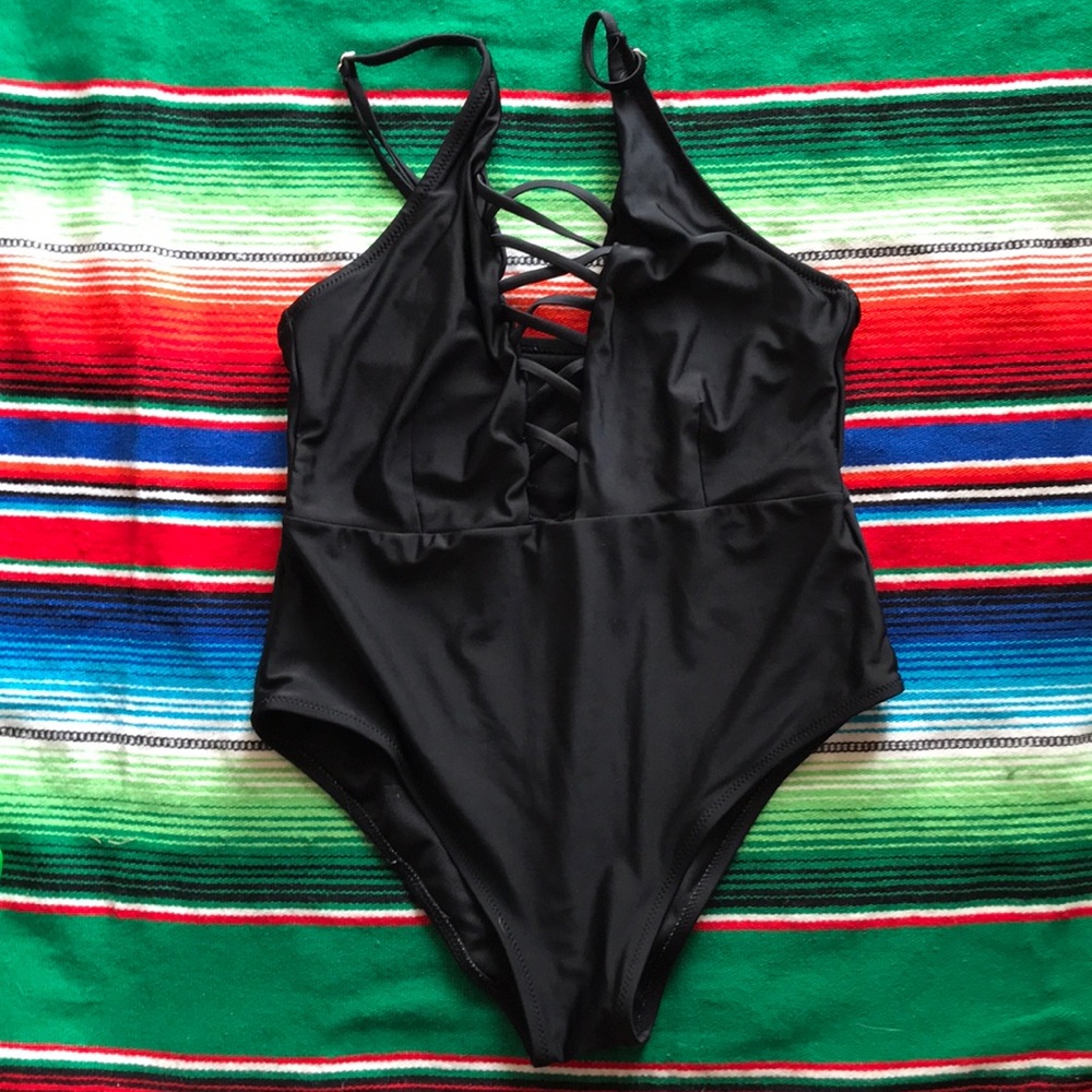 One piece swimsuit with lace up details